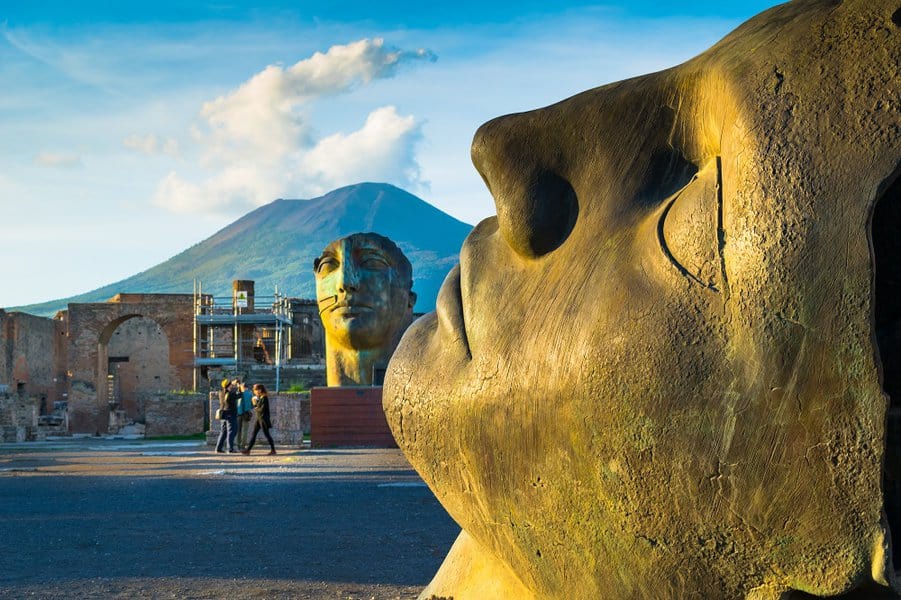 tourists visit the archaeological site of Pompeii