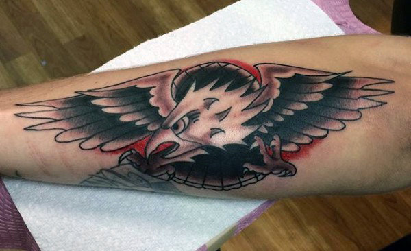 Forearm tattoo of an eagle with outstretched wings and a red circular background