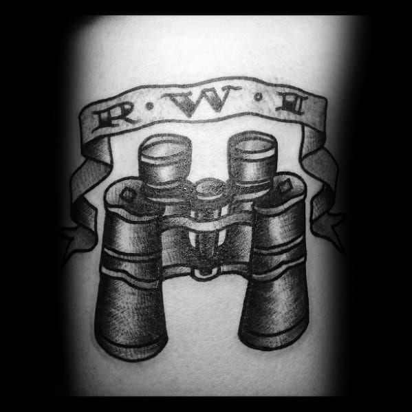 Black and grey binoculars tattoo with a ribbon banner featuring 'R.W.I,' giving it a vintage and personalized touch.