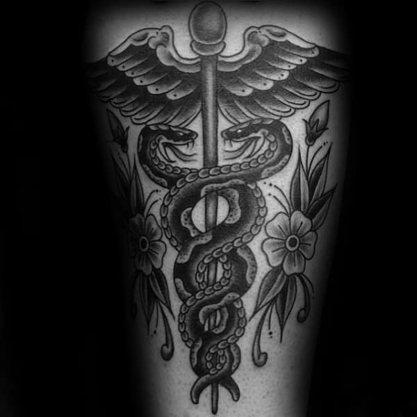 Traditional Caduceus With Flowers Mens Back Tattoo Ideas