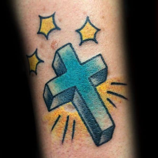 Bright blue 3D cross tattoo with yellow starbursts and rays around it, creating a glowing, celestial effect in traditional style.