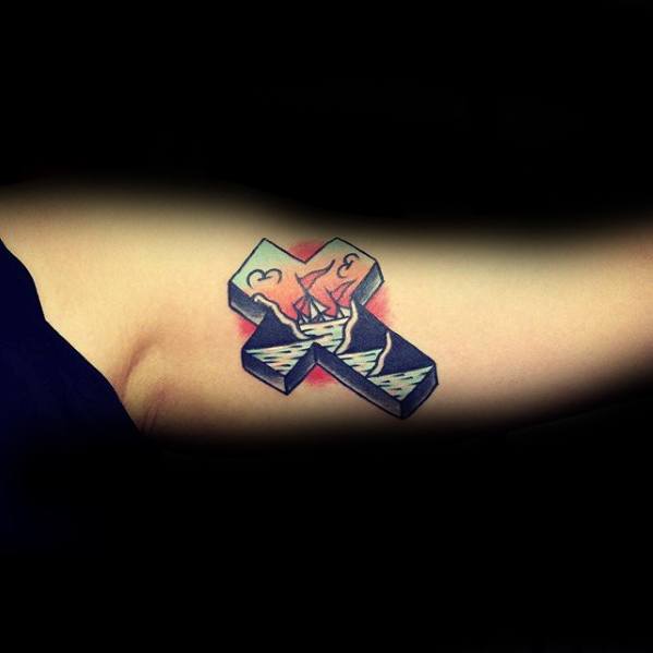 Tattoo of a 3D cross with red lightning and stormy waves inside, set against a subtle red background, inked on the inner arm.