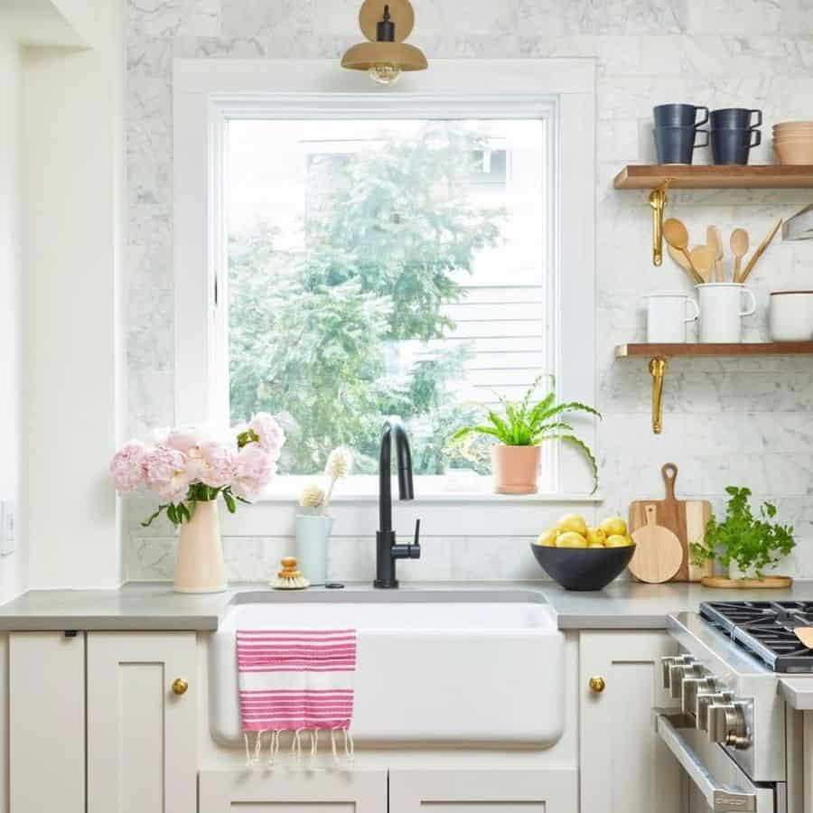 traditional kitchen with white cabinets apron sink