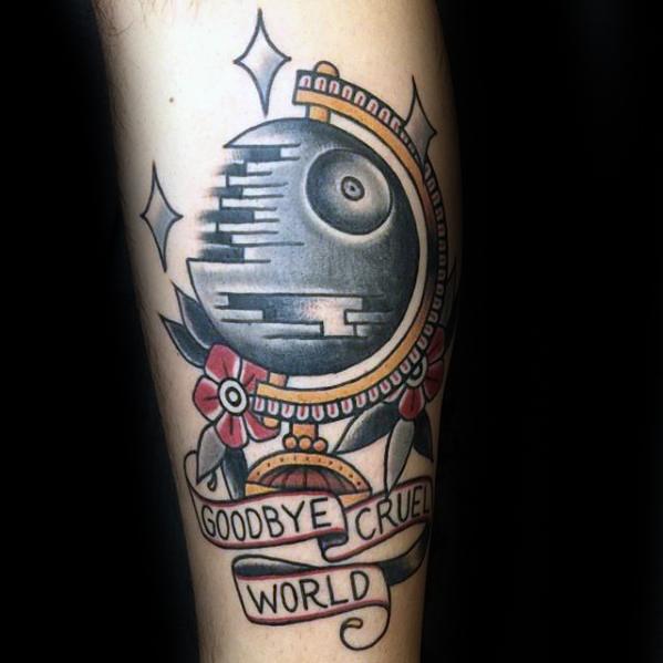 Tattoo of a Death Star-like globe with flowers, stars, and a banner saying "Goodbye Cruel World