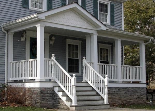 traditional country home front porch white railing stone skirting