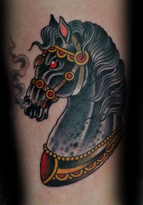 Traditional tattoo of a black armored horse head with gold and red accents, flowing mane, and steam coming from its nostrils.