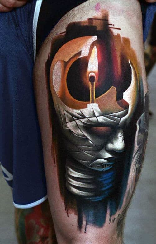 Tattoo of a candle melting over a wrapped, mummy-like figure on a thigh