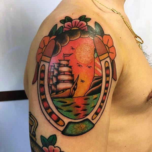 Traditional Mens Upper Arm Sailing Ship With Horseshoe Tattoo