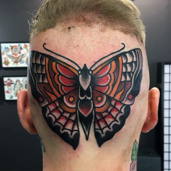 Traditional Moth Tattoo On Mans Back Of Head