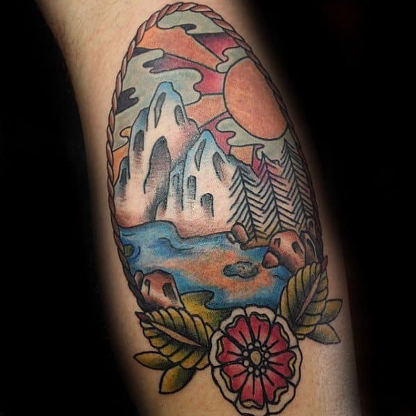 Traditional tattoo with rocky mountains, a flowing river, pine trees, and a bold sunset, framed by a rope border and a red flower.