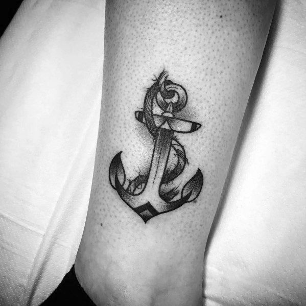 Realistic black and gray anchor tattoo with fine shading and a wrapped rope, symbolizing strength, stability, and a deep connection to the sea.