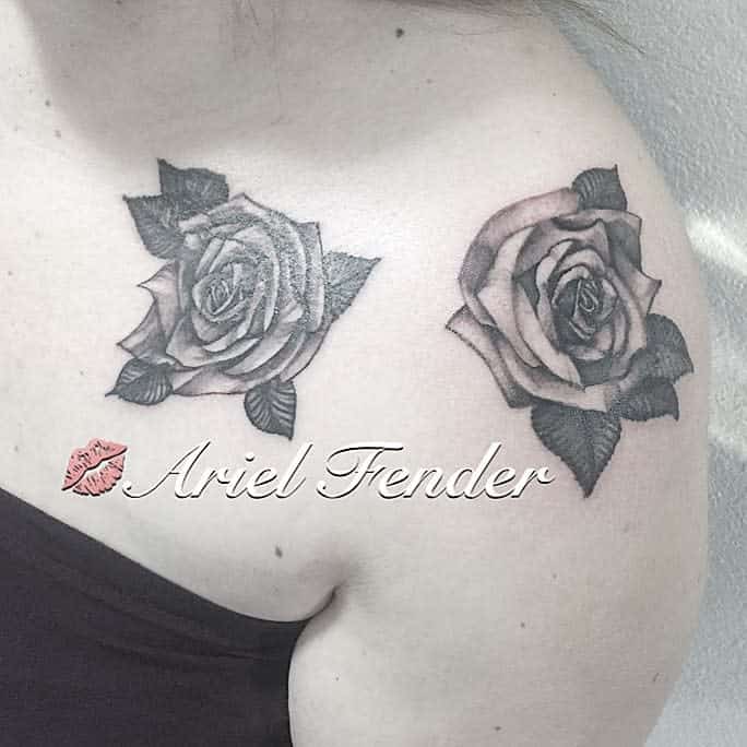 Two exquisite rose tattoos grace the shoulder