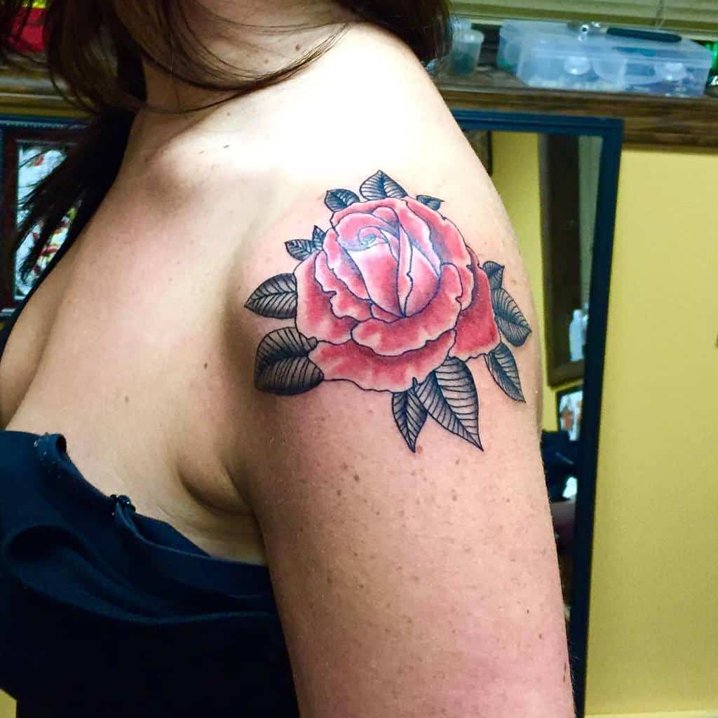 With a delicate pink rose tattoo gracing her shoulder
