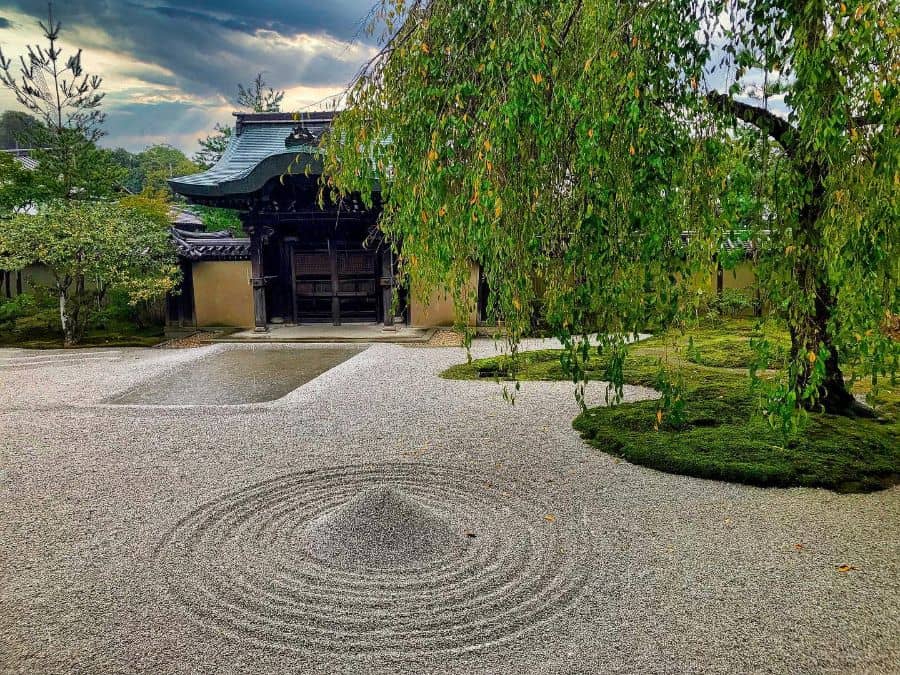 large traditional japanese rake garden with circular pattern 