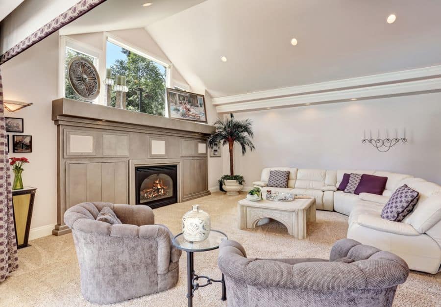 large family room white couch fireplace carpet