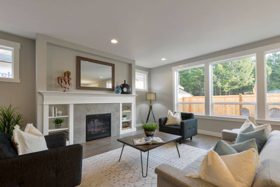 transitional family room brown table fireplace mirror 