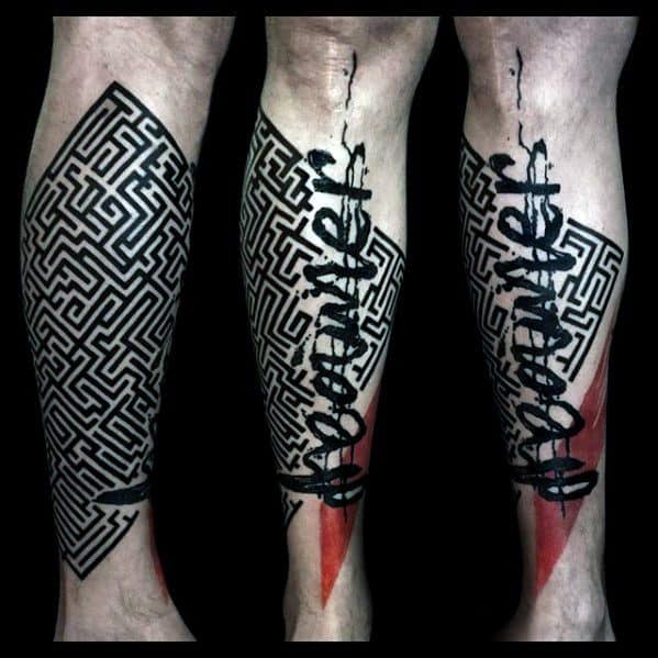 Calf tattoo featuring a bold black maze pattern with red geometric accents, overlaid by the word “Dreamer” in expressive black script.