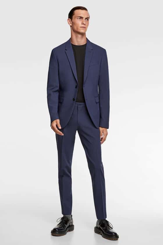 Jacket with pointed lapel collar and long sleeves with buttoned cuffs