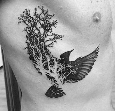 Tree And Crow Negative Space Male Rib Cage Side Of Body Tattoo Ideas