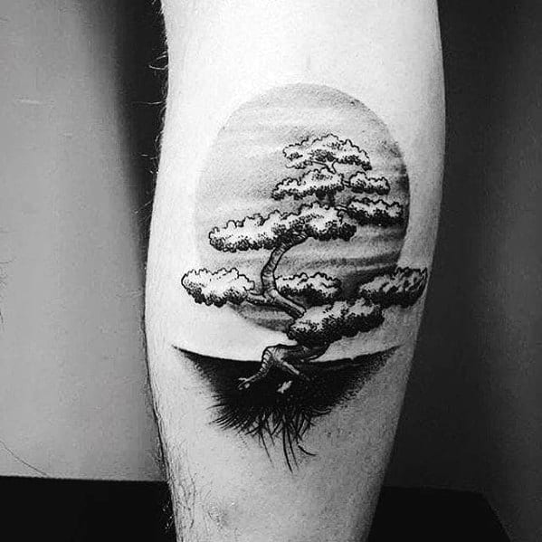 Black ink bonsai tree tattoo on the leg, featuring a twisted trunk, exposed roots, and a shaded circular background for a serene and artistic design.