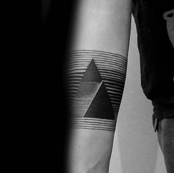 Arm with striped triangles tattoo design in black ink