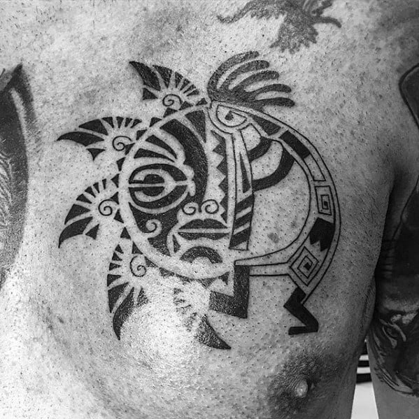 Intricate black Kokopelli tattoo with tribal geometric patterns and bold lines, emphasizing the figure’s unique facial features and stylized design on the chest.