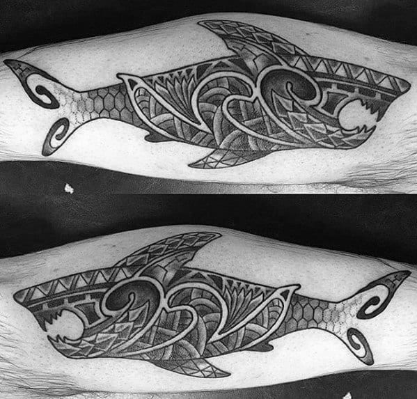 Matching Polynesian shark tattoos on forearms with intricate tribal patterns symbolizing unity, strength, and deep connection to ocean heritage.