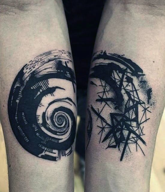 Abstract black ink tattoos on forearms featuring a spiral and geometric patterns