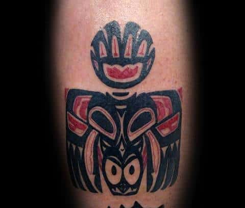 Tattoo design blending tribal art with the Ironman logo, incorporating bold lines and vivid colors to represent strength and endurance in a unique, artistic form.