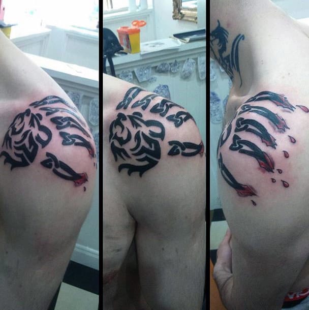 Tribal Mens Bear Claw In Skin Tattoo