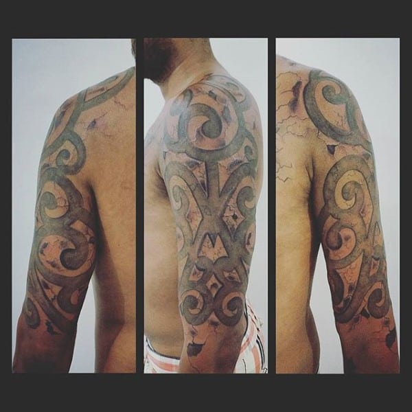 Tribal Stone Half Sleeve Tattoo On Man