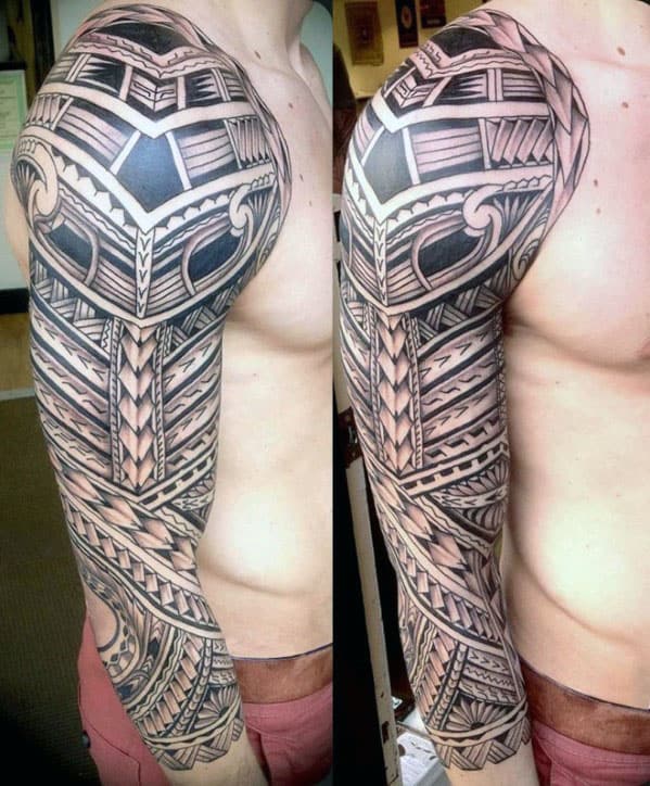 A person with a detailed Polynesian tribal sleeve tattoo on their right arm