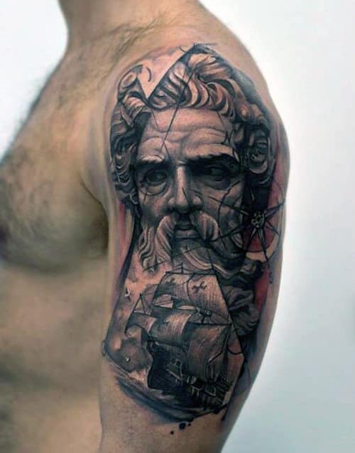 Detailed tattoo of a bearded man and sailing ship on a man's upper arm