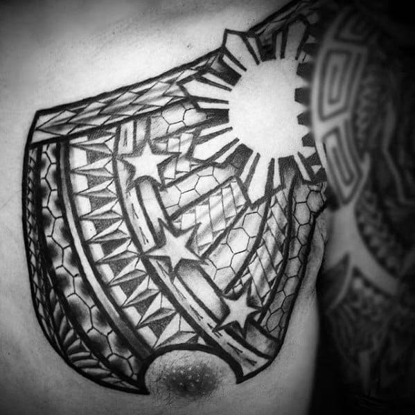 Filipino sun chest tattoo with bold rays, multiple stars, tribal weaving patterns, and shaded honeycomb textures creating a dynamic upper body design.