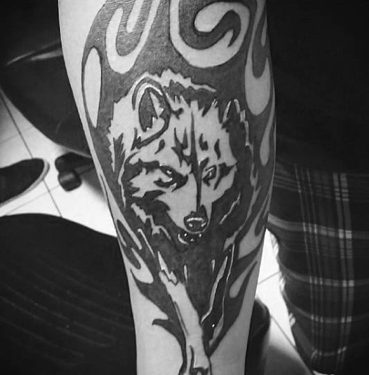 Tribal Wolf Walking Mens Inner Forearm Tattoo