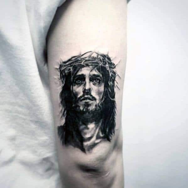 tricep-small-religious-jesus-portrait-tattoo-for-men