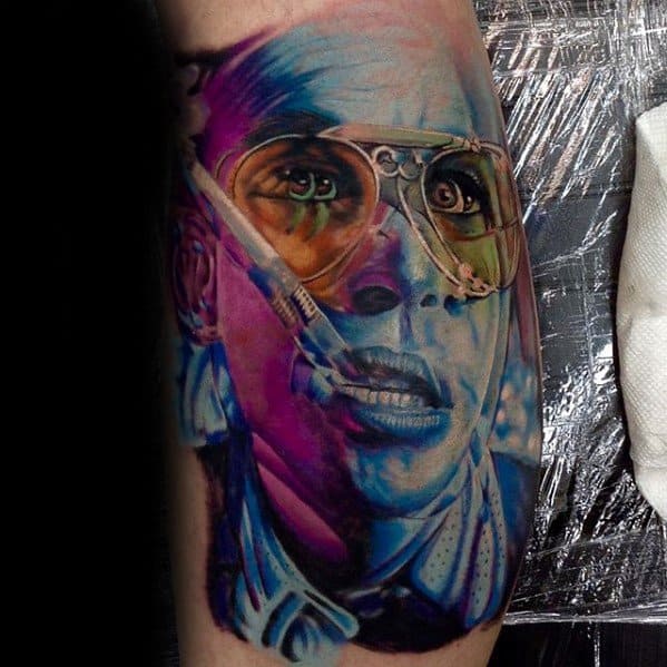 Hyper-realistic and colorful tattoo of a woman in medical or sci-fi gear, featuring reflective goggles and intense blue and purple tones.