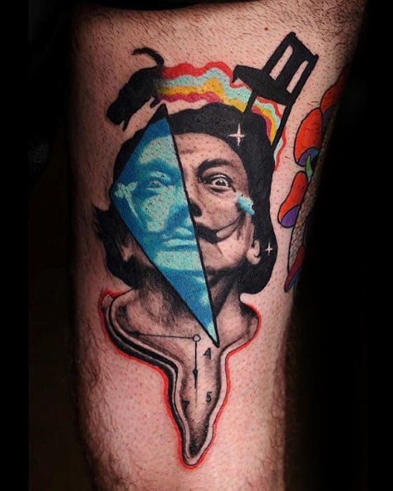 Surrealist tattoo of Salvador Dalí with a melting base, a blue triangular overlay showing another expression, and abstract elements like a chair and cat.