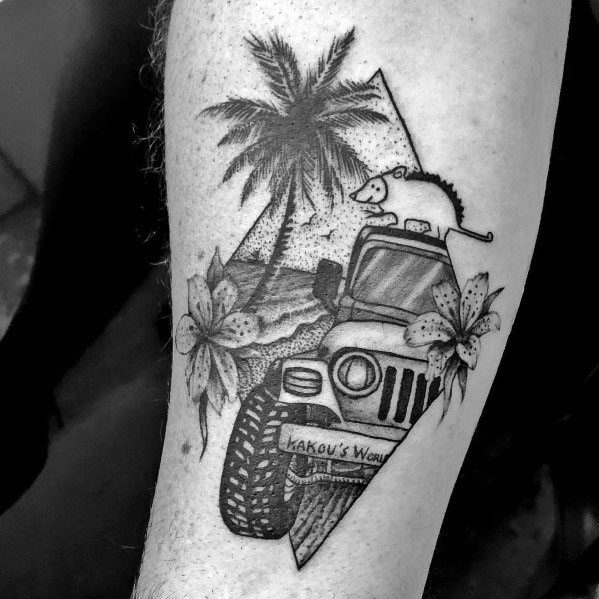 Black and grey tattoo of a Jeep on a tropical beach, featuring palm trees, flowers, and a rat on the roof, blending adventure with artistic detail.