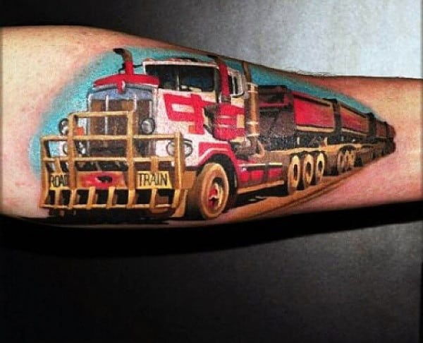 Tattoo of a large red road train truck with trailers on a forearm against a blue and brown background