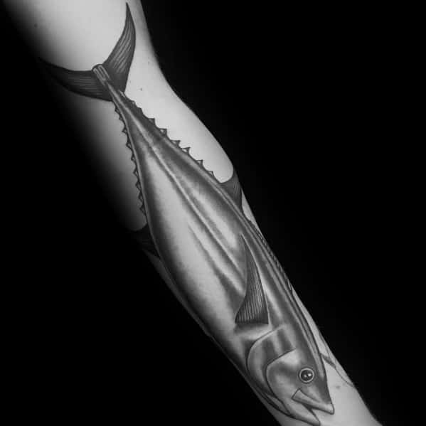 Realistic black and grey tuna fish tattoo on a man's arm, featuring smooth shading, fine details, and a lifelike ocean-inspired design.