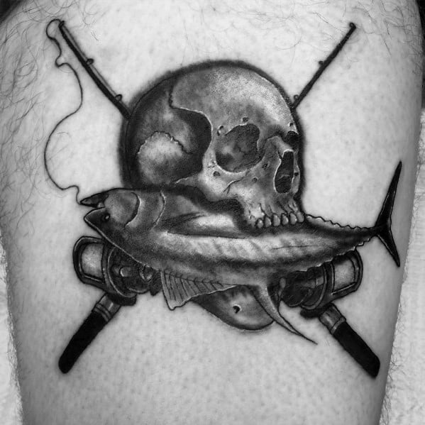 Black and grey tuna fish tattoo featuring a skull, crossed fishing rods, and bold shading for a striking nautical and pirate-inspired design.