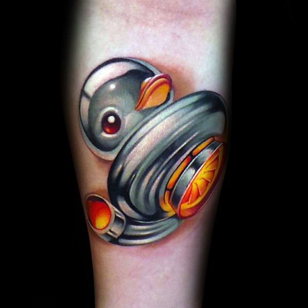Colorful **turbo duck** tattoo blending a **rubber duck with a turbocharger**, featuring vibrant shading, symbolizing a fun mix of speed and humor.