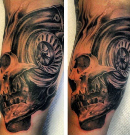 Tattoo of a skull with mechanical elements on an arm, in grayscale, featuring intricate shading and details