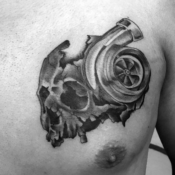 Realistic **skull and turbocharger** tattoo on the chest with fine shading and a torn effect, symbolizing speed, power, and a fusion of life and mechanics.