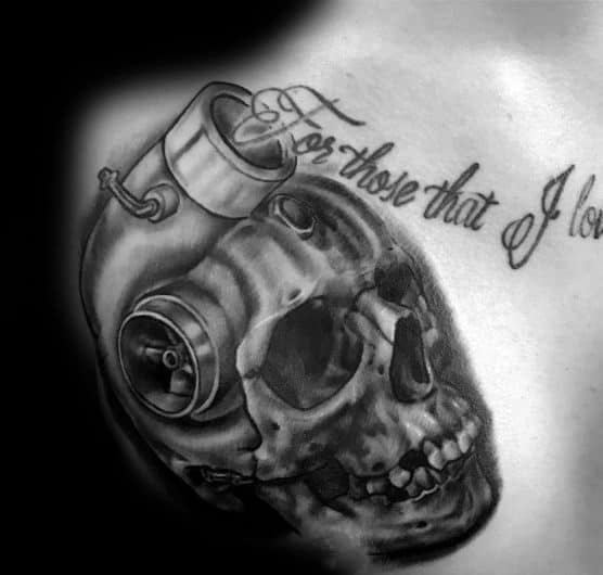 Realistic **skull and turbocharger** tattoo on the chest with fine shading and script text, symbolizing speed, mortality, and a passion for automotive power.