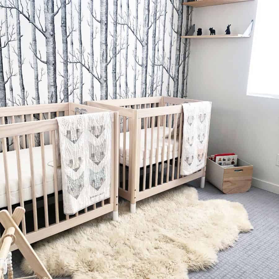 twins nursery wood cribs wall shelves forest wallpaper