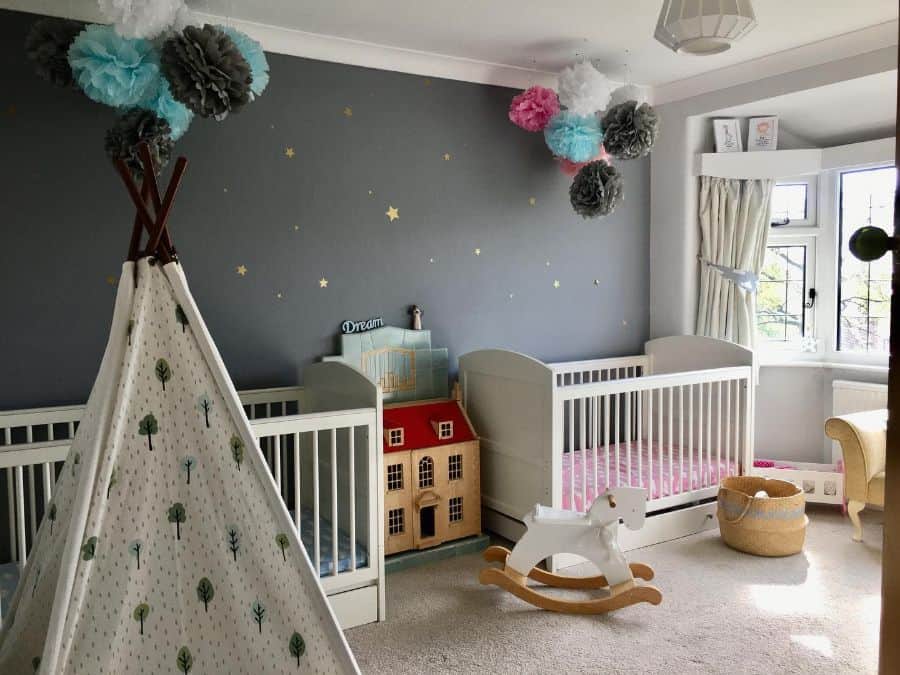 twins nursery two white cribs teepee night sky feature wall rocking horse