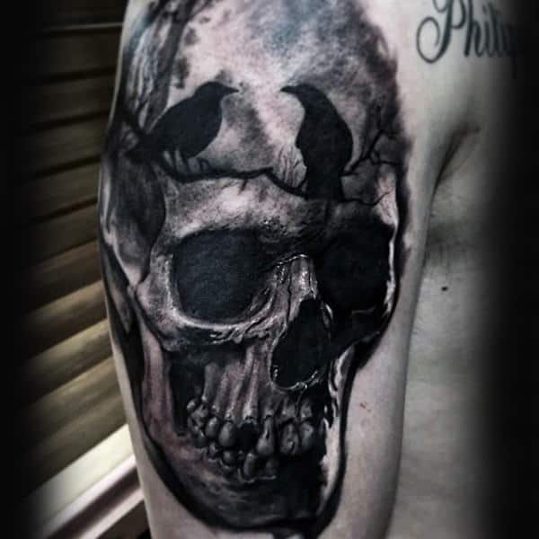 Two Crows Sitting On Tree Branch With Skull Upper Arm Tattoo For Males
