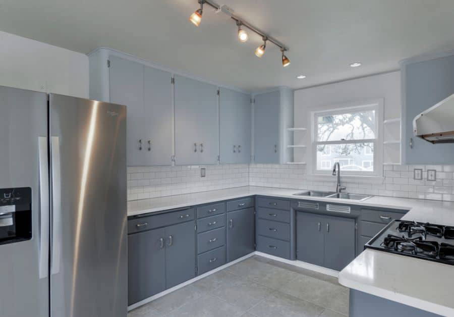 two tone gray cabinet kitchen white subway tile backsplash